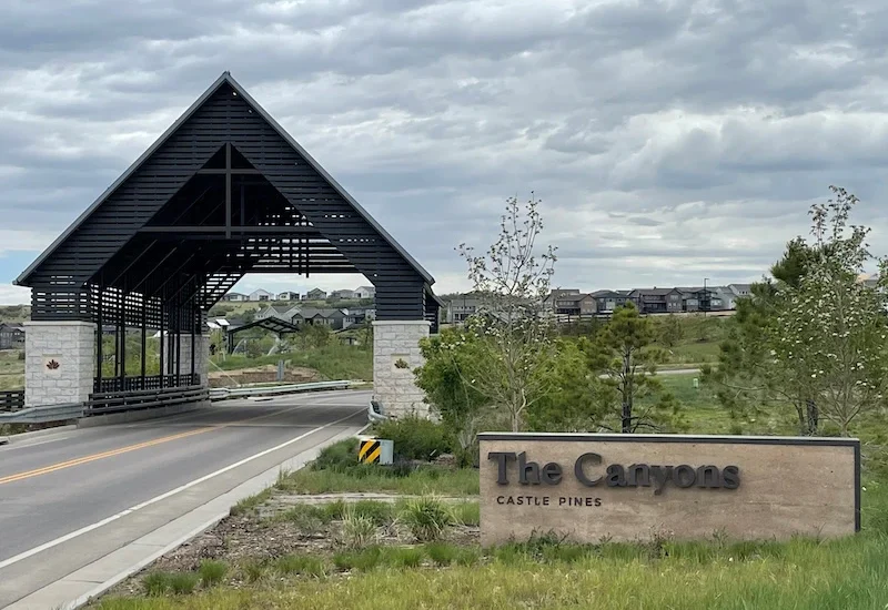Bridge and sign entering The Canyons by Terracina Design.